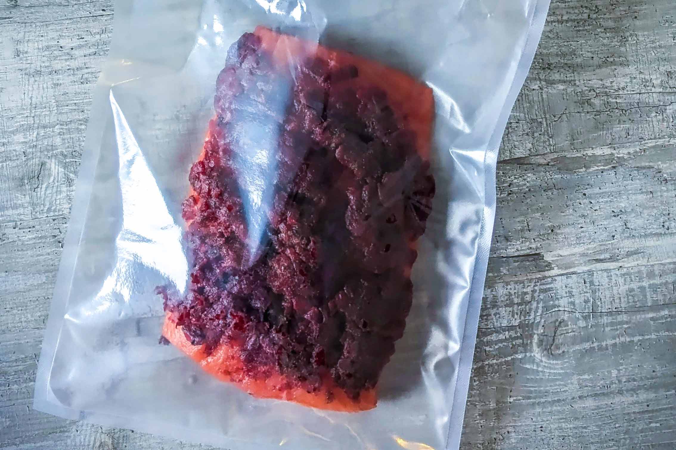 Salmon with beetroot marinade in a vacuum bag