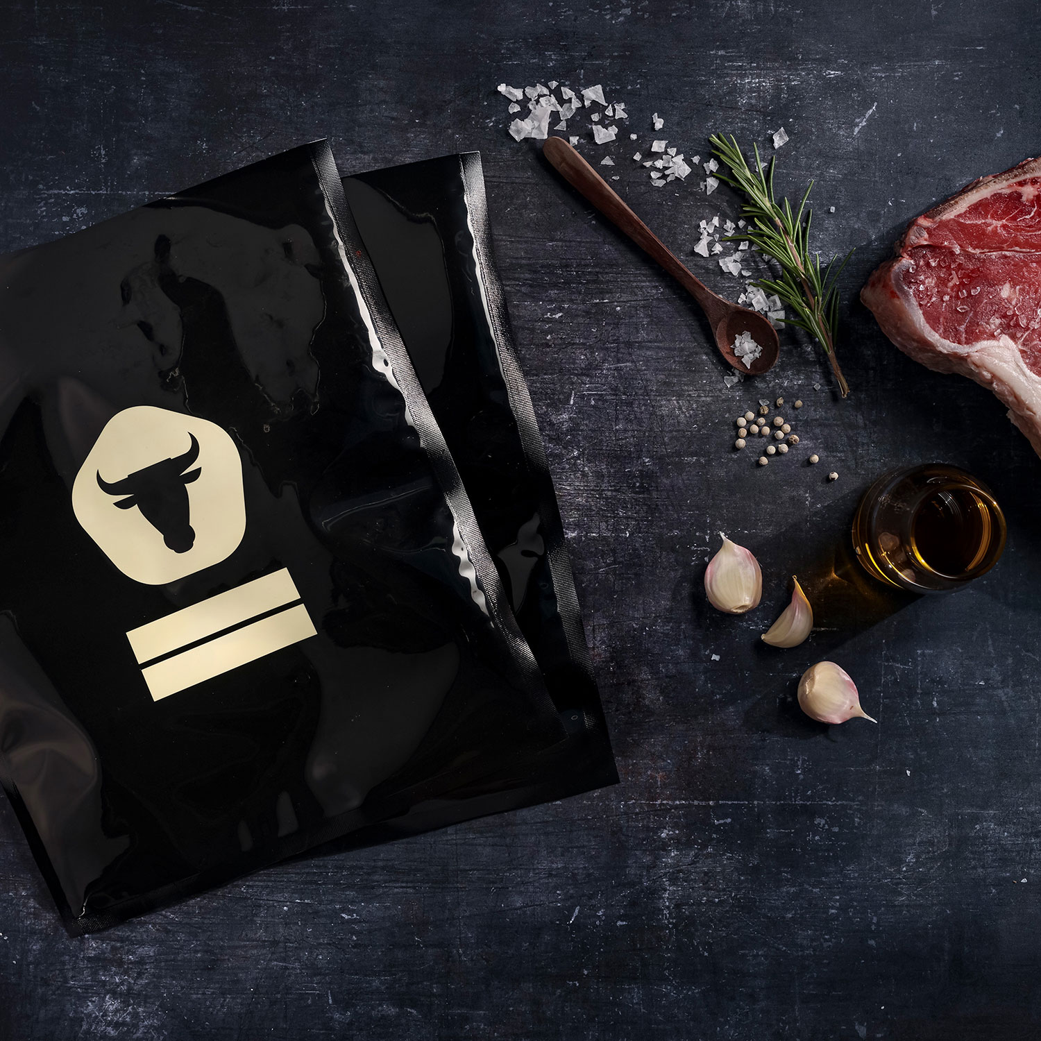 Black vacuum bags with dry ager logo and t-bone steak