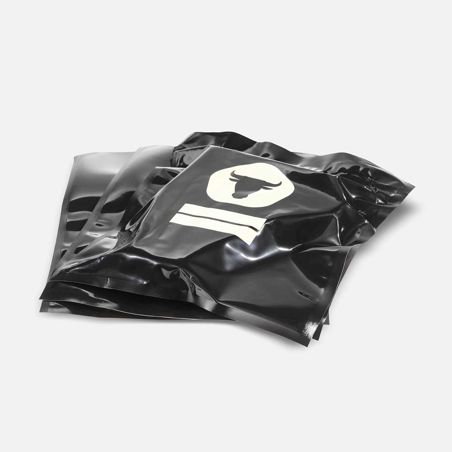 Black vacuum bags with dry ager logo with vacuumed T-Bone steak