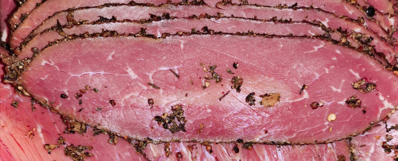 Homemade pastrami sliced thinly