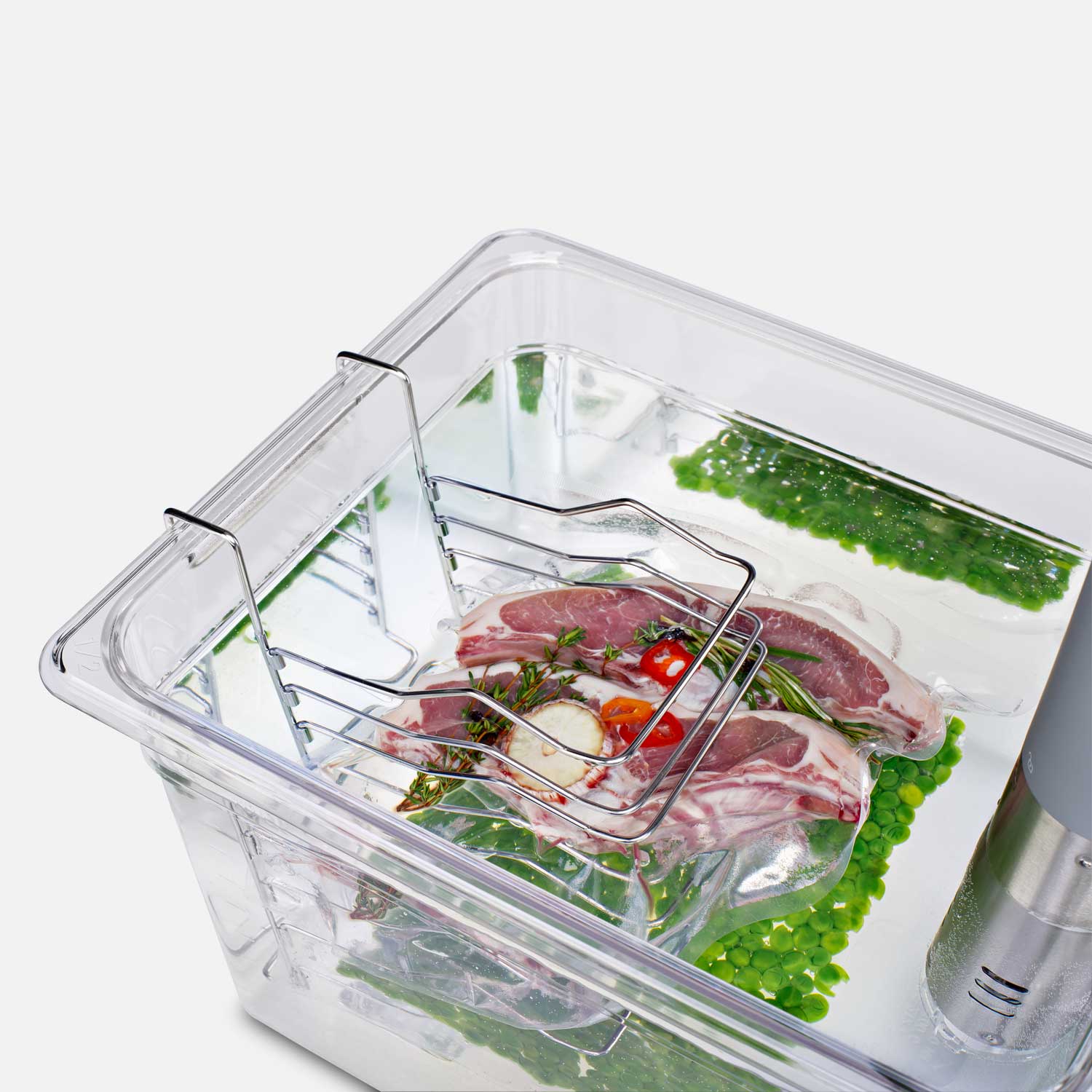 Small bag holder hung inside the sous-vide basin and filled with a vacuum-sealed bag of meat