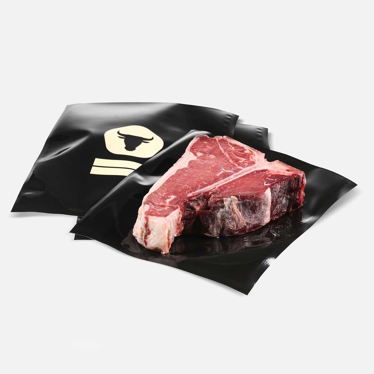 Black vacuum bags with T-Bone steak