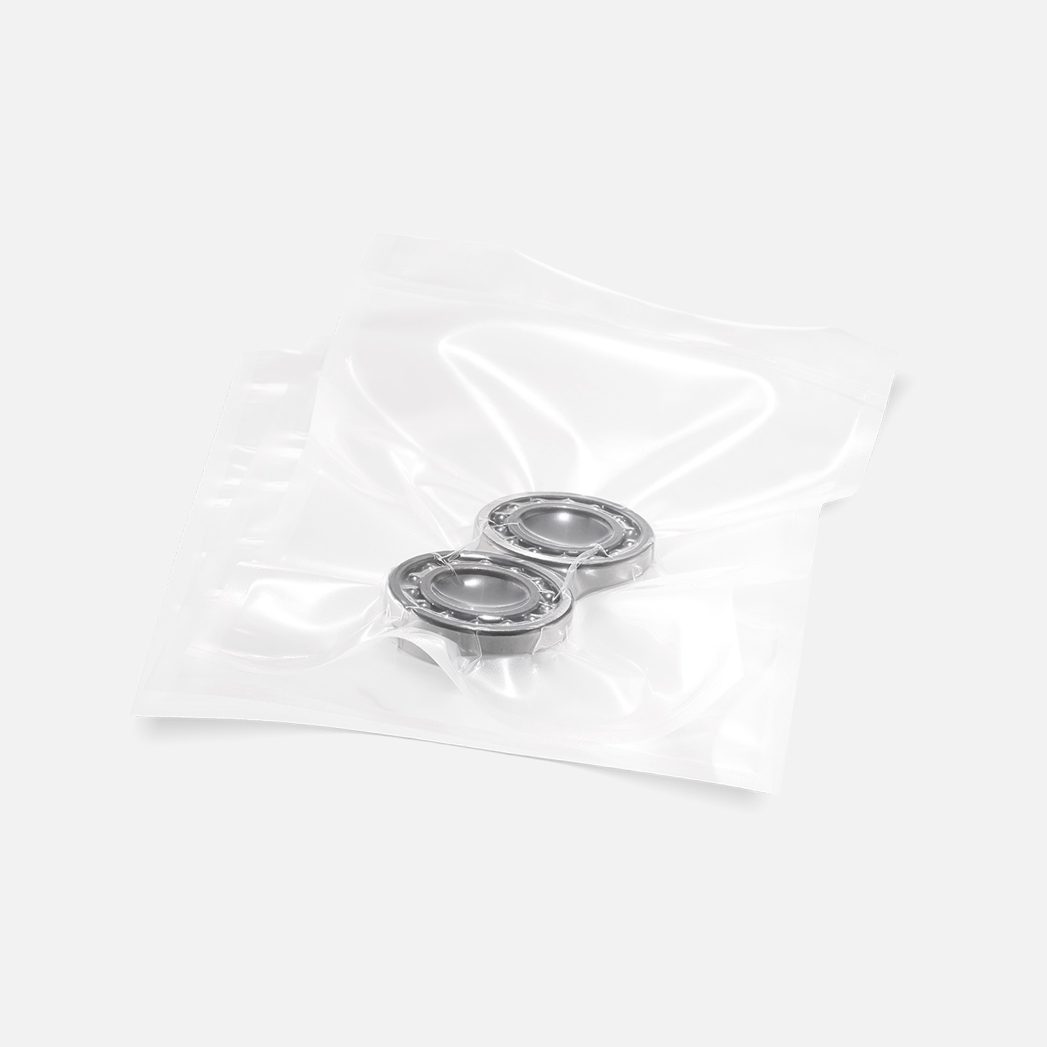 Transparent structured vacuum bag vacuum-sealed with ball bearings