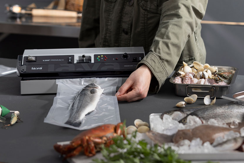 Fresh trout is vacuumed with a vacuum sealer