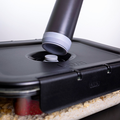 The electric vacuum pump is placed on the lid of the G-Line glass container.