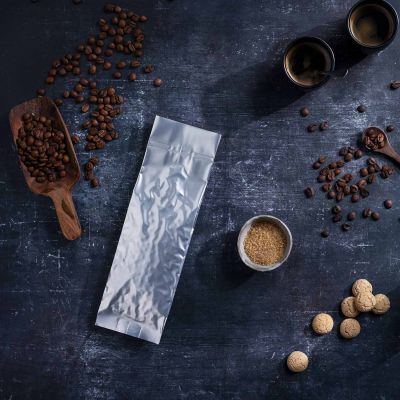 Metallized vacuum bags vacuum-sealed with coffee beans